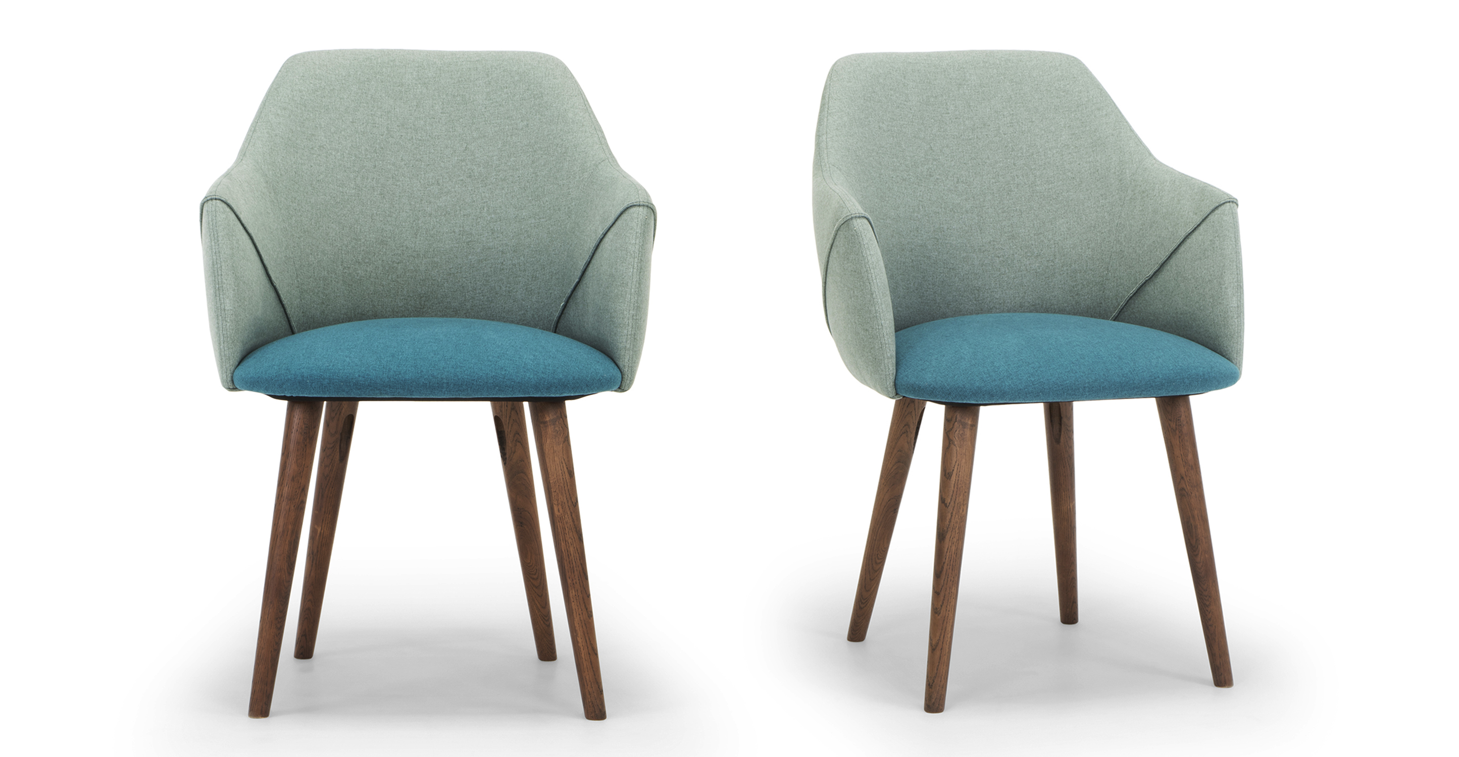Two Berki dining Chairs in Adriatic/Scuba fabric which is 100% Polyester. Seat cushion is blue upholstery, remainder of upholstery is soft green. Stiletto legs are stained walnut. Slanted piping gives dimension to the chair. Back of chair is higher with a gentle slope down to solid arms.
